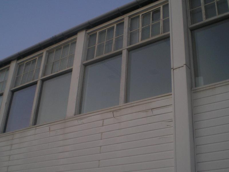 An upstairs window at the back of the old building
