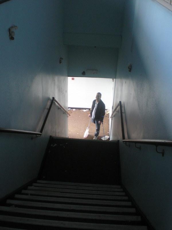 DiscoKev waiting at the bottom of the stairs inside the old reception building
