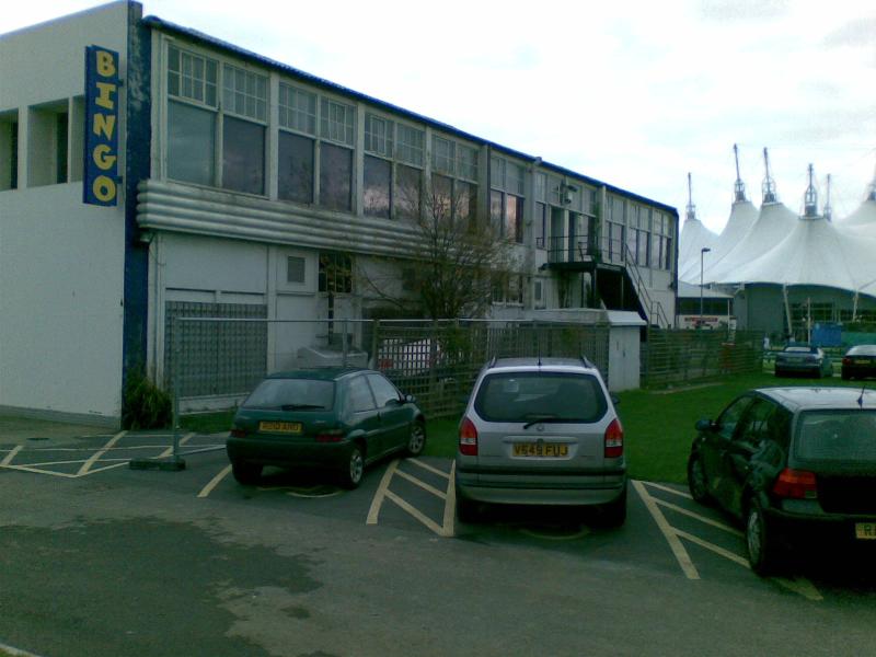 The side of the old reception building with the Skyline in the background