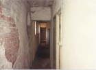 View from top of stairs looking down past projection room