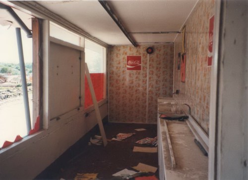 Inside the middle shop. At the end on the right is the sink wash area