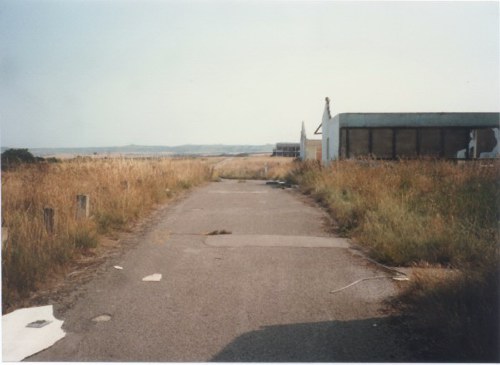 Taken from around the bend. The road curves to the left and continues down to the beach gate. There is a side road to the right which leads to Blue Camp