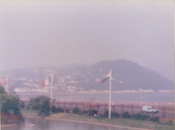 Coast with the boating lake & flags in the foreground