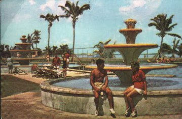 Tom & Margaret posing by the fountain of the outdoor pool